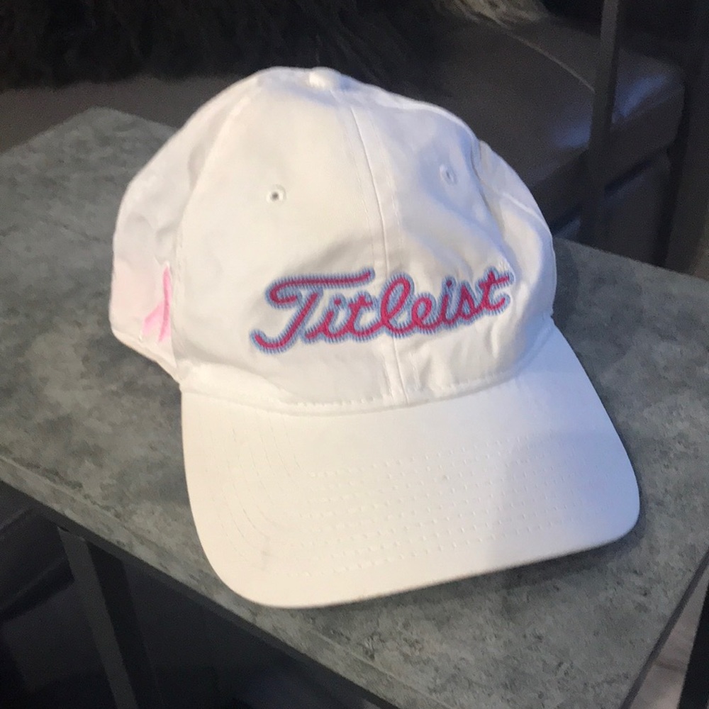 White baseball cap with breast cancer decals